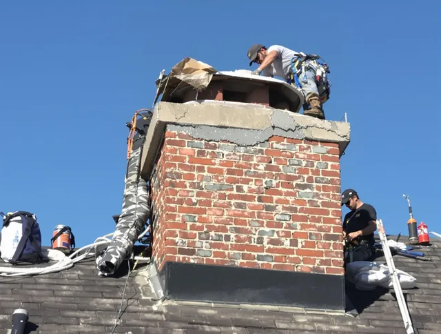 Georgetown Chimney Sweep installing a custom chimney crown in Georgetown, GA