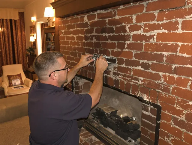 Georgetown Chimney Sweep expert fixing a fireplace in Georgetown, GA